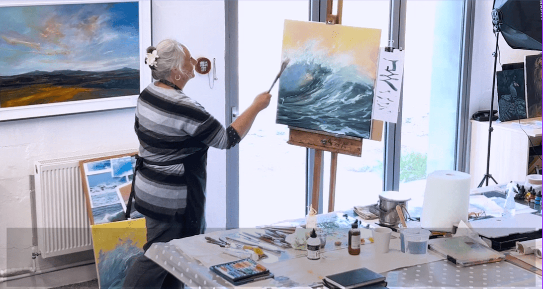 Sarah Jane Brown demonstrating how she paints a wave